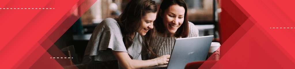 Women working around a laptop in New Brunswick