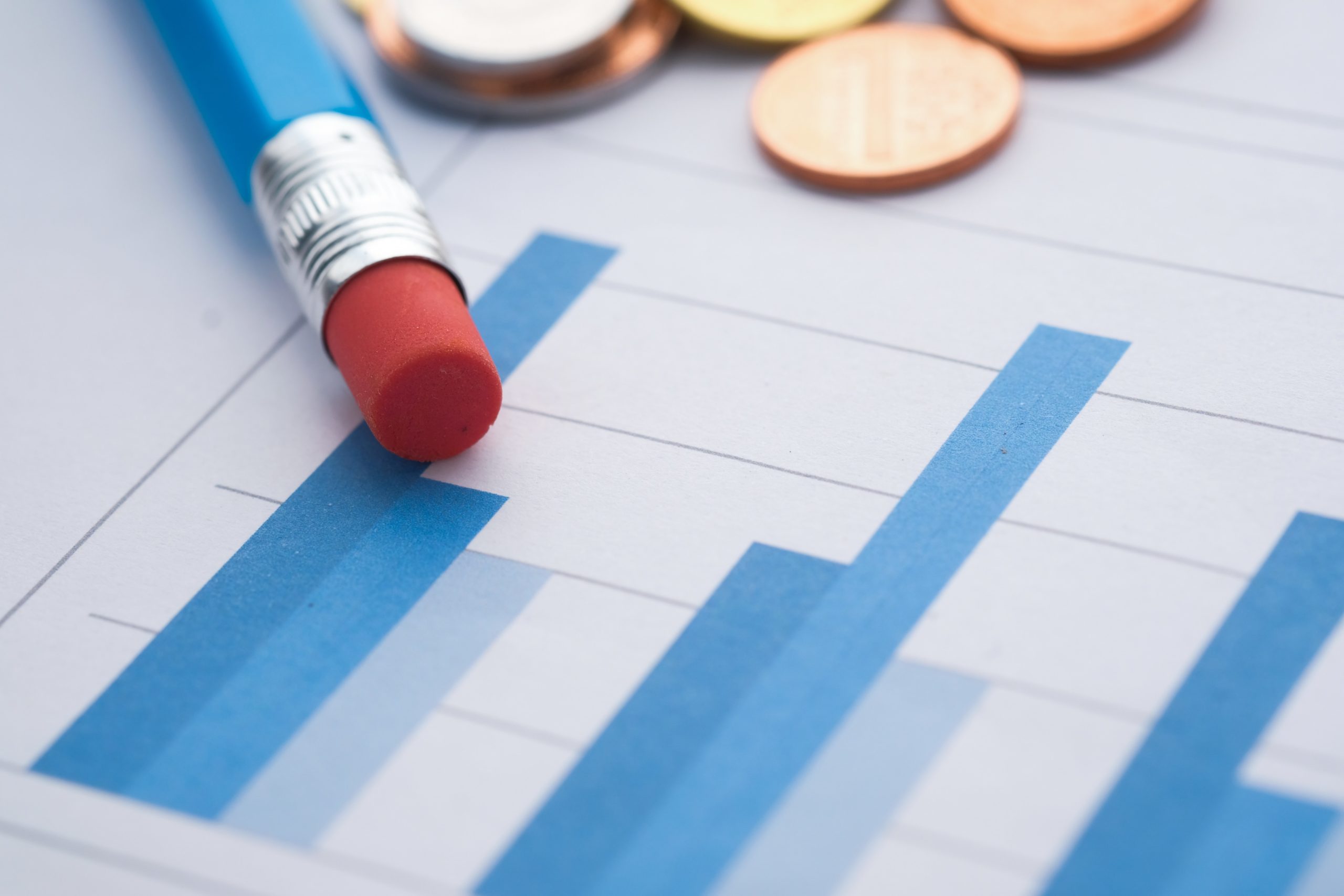 Graphs showing digital marketing results and a pencil